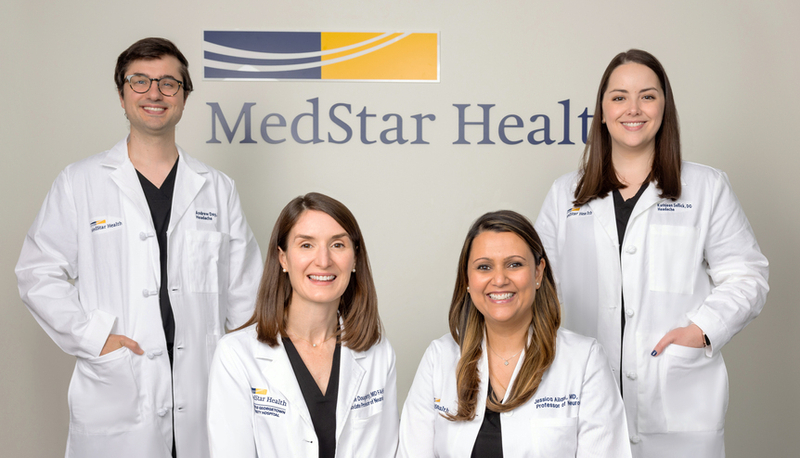 A team of physicians from the MedStar Health headache center smile as they pose for a group photog.