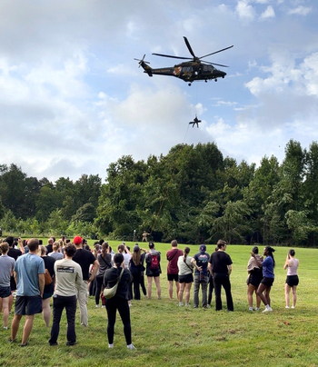 Residents participate in a wilderness rescue training event.