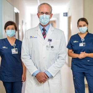 A doctor and 2 nurses pose for a photo at MedStar Health.