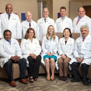 A group of MedStar Health Transplant Institute doctors poses for a group photo in a hospital lobby.