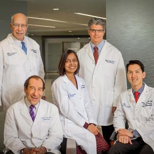 A group of 5 doctors from the MedStar Health Pituitary specialty group pose for a photo in the lobby of MedStar Washington Hospital Center.