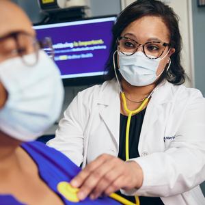 Dr Toni Turner listens to the heart of a patient during an office visit at MedStar Health.