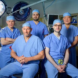 A team of transplant surgeons from MedStar Georgetown University Hospital pose for a group photo in the operating room.