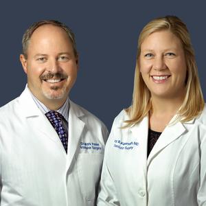 A doctor performs a treatment for vericose veins on a patient in a clinical setting.