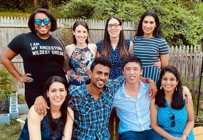 MedStar Health's Family Medicine Residency - Baltimore class of 2020 - sitting together in a garden outdoors.