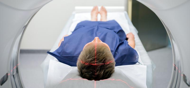 A patient undergoes a diagnostic radiology scan.