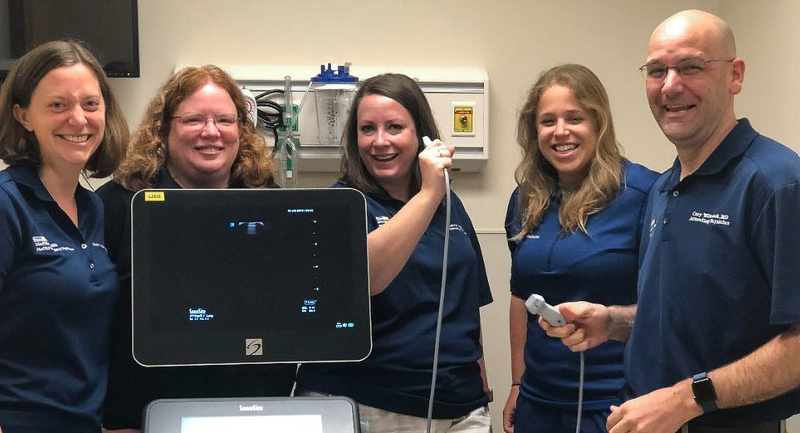 Students in the Emergency Medicine Ultrasound Fellowship Program pose for a photo.