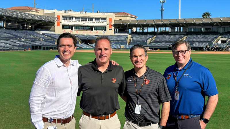 Group photo of MedStar Health sports medicine physicians and a sports medicine fellow at Orioles training camp.