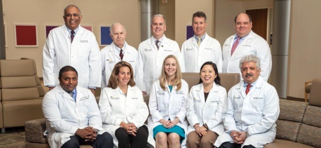 A group of MedStar Health Transplant Institute doctors poses for a group photo in a hospital lobby.