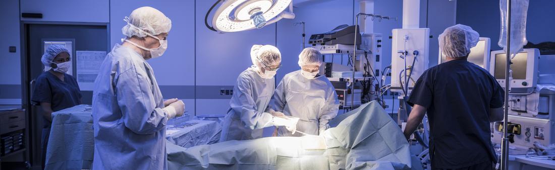 A surgical team works in the operating room at a hospital.