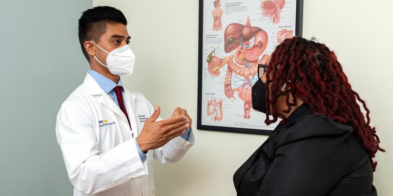 Dr Mark Real talks with a patient during an office visit at MedStar Health.