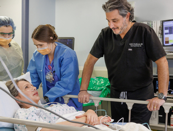 Dr. Walid Chalhoub checks on a patient after a procedure at MedStar Health.