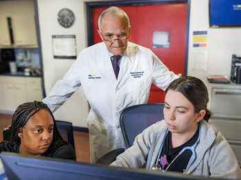Dr. Nadim Hadid consults with colleagues at MedStar Health.