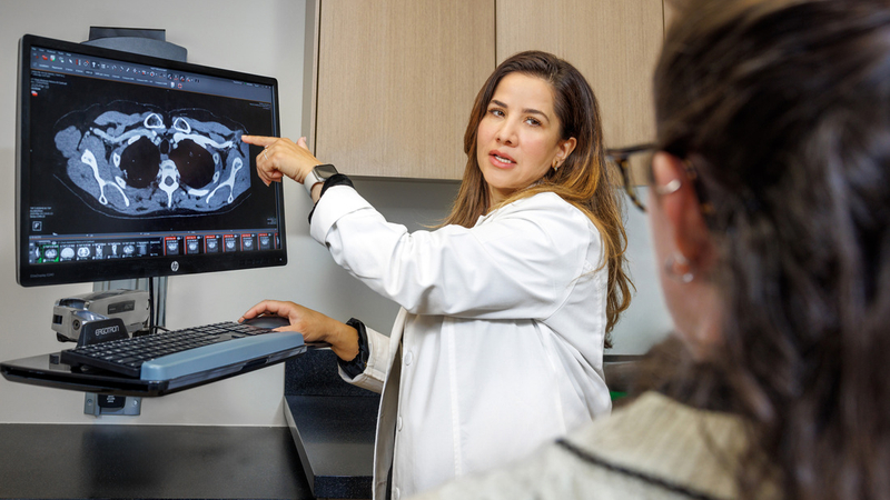 A doctor reviews diagnostic imaging scans with a patient at MedStar Health.