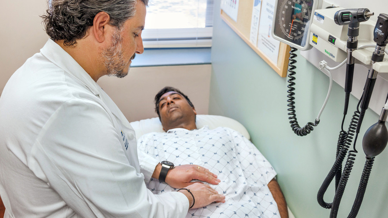 Dr. Chalhoub performs an abdominal exam on a patient at MedStar Health.