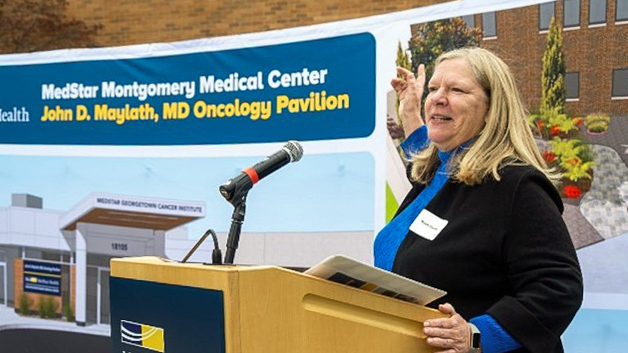 Marian Mylath, daughter of Dr. John D. Mylath, speaks at a podium at MedStar Montgomery Medical Center.