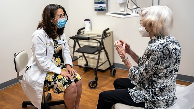 A doctor talks with a senior woman during an office visit at the Center for Successful Aging at MedStar Health.