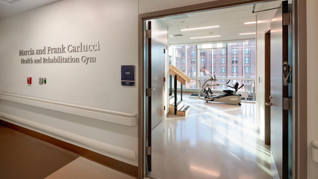 View of the Carlucci Rehabilitation Gym from the hallway in the Verstandig Pavilion at MedStar Georgetown University Hosptial.
