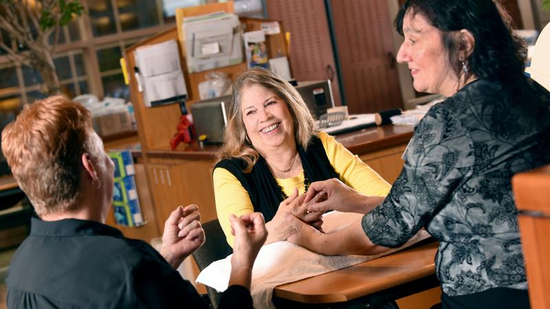 A hand therapist works with a patient following successful surgery at MedStar Health.