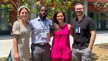 A group of fellows from the Infectious Disease Fellowship Program at MedStar Georgetown pose for a group photo outdoors.