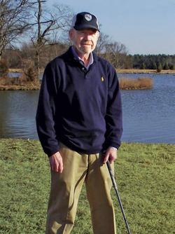 Jack Yeatts poses for a photo on the golf course, after undergoing successful proton therapy at MedStar Georgetown University Hospital.