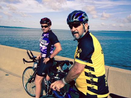 John Arthur and Dan Kornacki pose for a photo while out for a bike ride.