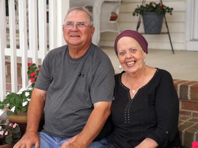 Kathleen Norris poses with her husband after undergoing successful proton therapy treatment at Medstar Georgetown University Hospital.