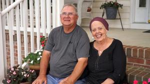 Kathleen Norris poses with her husband after undergoing successful proton therapy treatment at Medstar Georgetown University Hospital.
