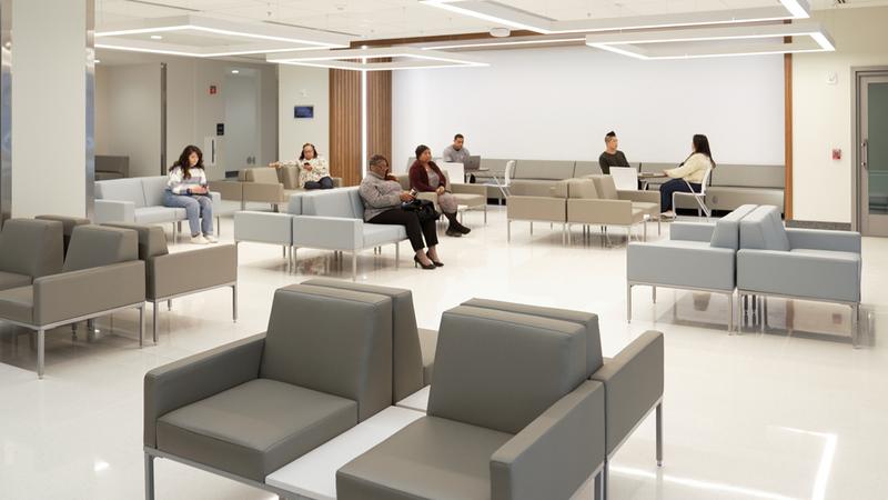 People sit in the lobby of the emergency department in the Verstandig Pavillion at MedStar University Georgetown Hospital.