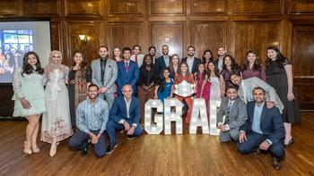 A group of graduates from MedStar Health's Internal Medicine Residency program in Washington DC hold a sign indicating where they matched for continued training.