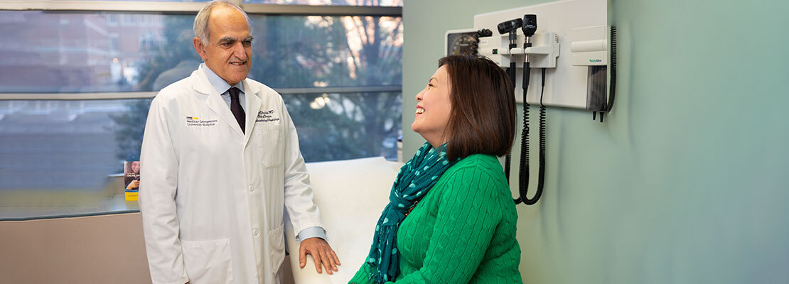 Dr Nadim Haddad talks with a patient during an office visit at MedStar Georgetown University Hospital.