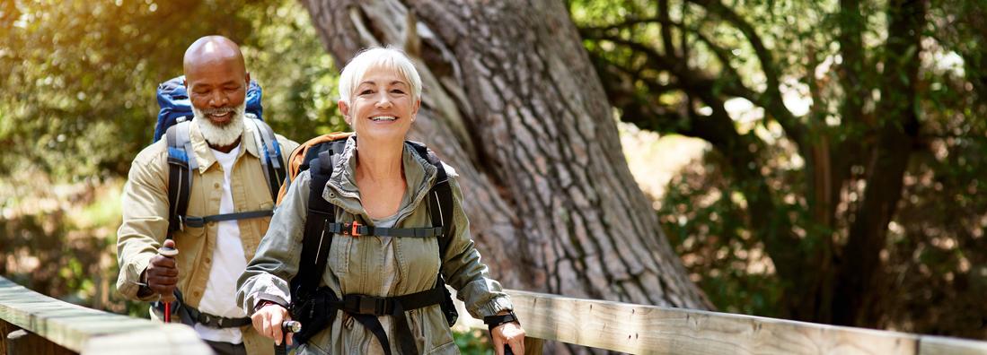 Shot of a senior couple enjoying themselves while out for a hike.
