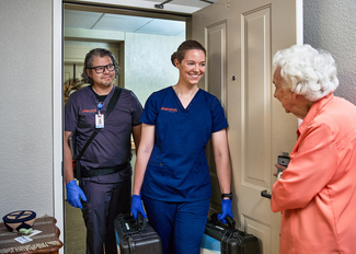 Providers from Dispatch Health arrive at a client's home.