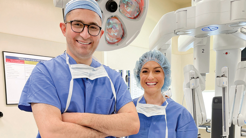 Doctor Sameer Alrefai and Nurse Practitioner Katelyn Edinger pose for a photo in an operating room at MedStar St. Mary's Hospital.