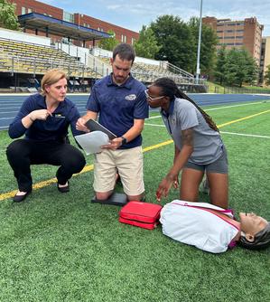 Dr Korin Hudson works with staff to produce a video demonstrating emergency CPR.