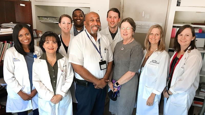 Curtis Reese stands together with his care team at MedStar Health.