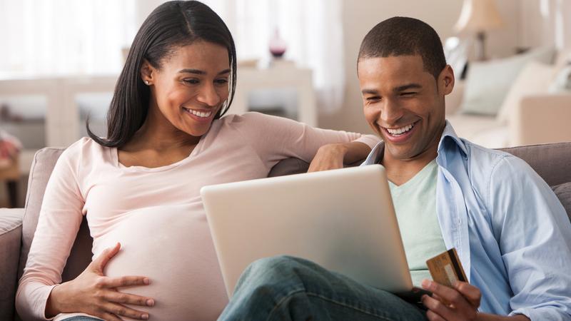 A couple, who is expecting a baby, participates in an online class.