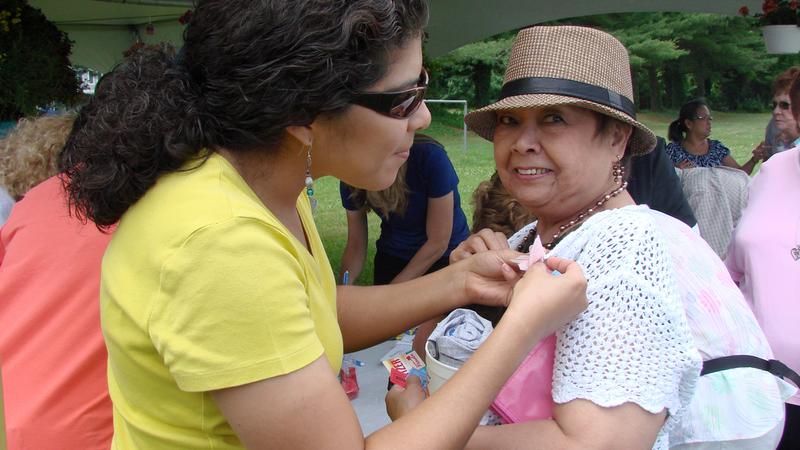 Cancer survivors socialize at a picnic.