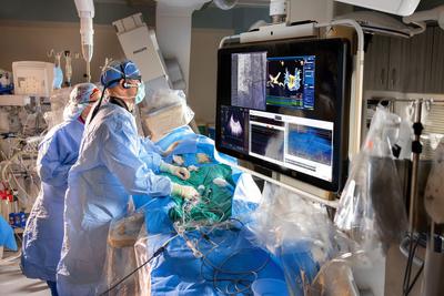 Dr Glenn Meininger performs a surgical procedure in the cardiac catheterization lab at MedStar Health.