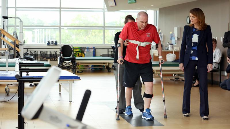 Congressman Steve Scalise walks with assistance during rehabilitation at MedStar National Rehabilitation Hospital.