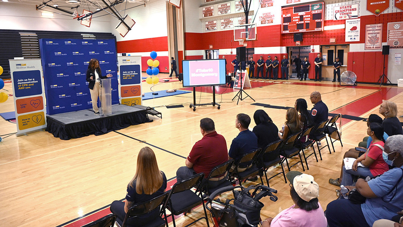 Experts from MedStar Health participate in a community health event to teach how to perform CPR and use an AED in an emergency.