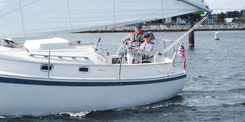 Diane and John Haderly enjoy time together on their sailboat.
