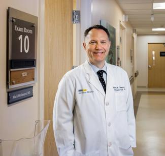 Dr. Mark Hofmeyer poses for a photo outside of an exam room at MedStar Health.