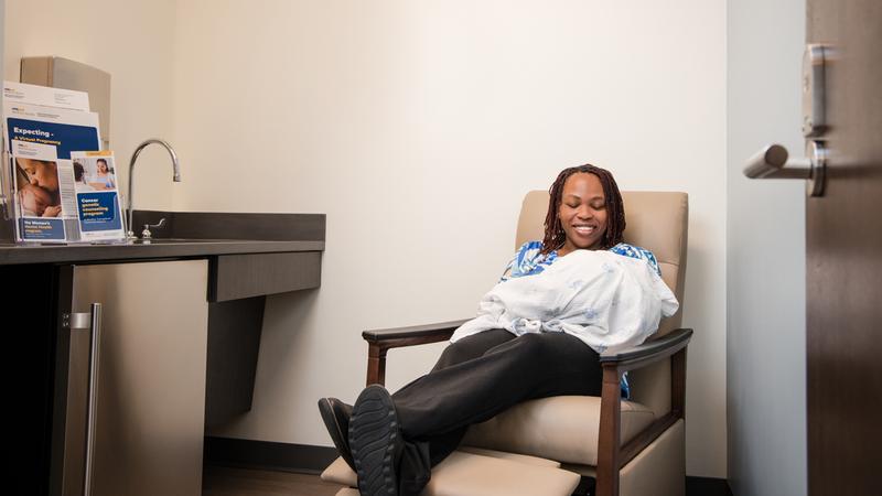 A woman feeds her newborn baby in a wellness room at the MedStar Health Obgyn office at Glover park.