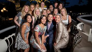 A group of alumni from the MedStar Health Otolaryngology Head and Neck Residency program stand together for a group photo outdoors.