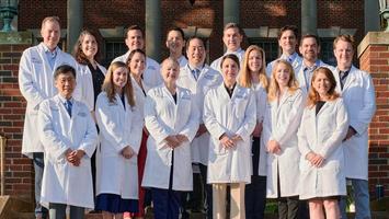 A group of faculty from the MedStar Health Otolaryngology Head and Neck Residency program stand together for a group photo outdoors.