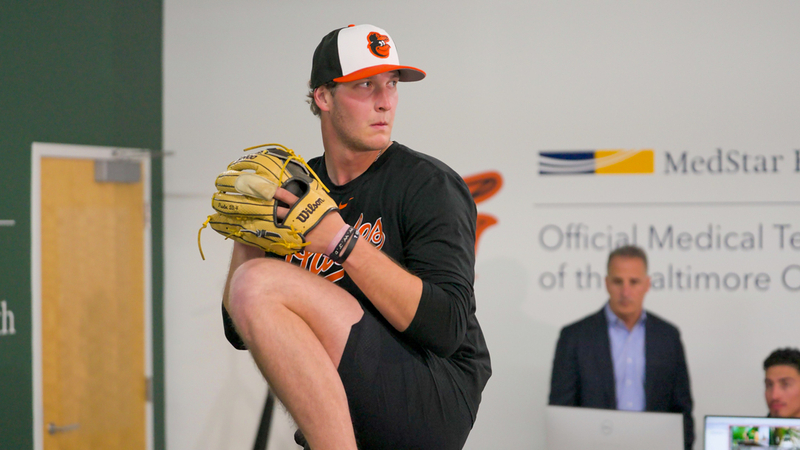 A pitcher for the Baltimore Orioles throws a pitch at the MedStar Health pitching lab.
