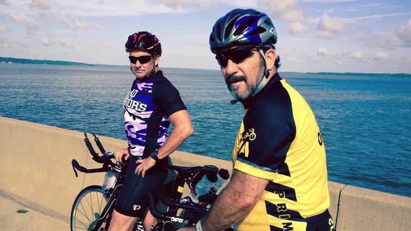 John Arthur and Dan Kornacki pose for a photo while out for a bike ride.