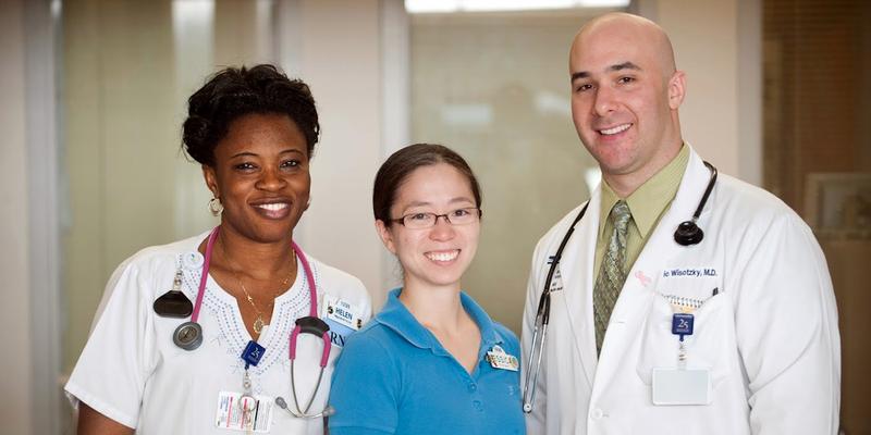 Dr Eric Wisotzsky stands with 2 pharmacy residents at MedStar Health.