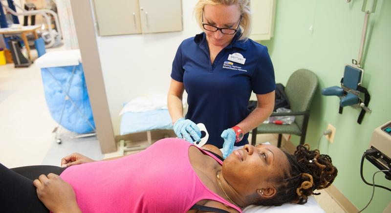 A MedStar Health physical therapist works with a patient during a therapy session.